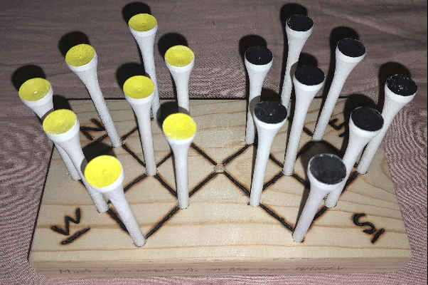 Photograph of my English Sixteen game with the golf-tees set up on the board